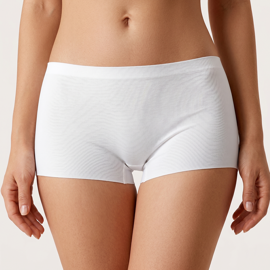 White underwear worn by a person on a plain background