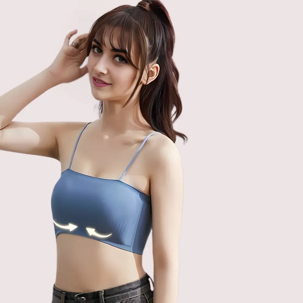 Woman wearing a blue bralette with a light-up design on a plain background
