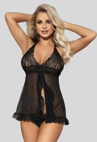 Woman wearing a black lace lingerie set on a plain background