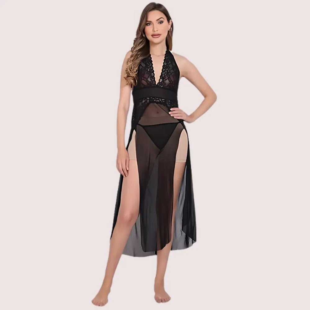 Woman wearing a black lace lingerie set with sheer panels on a beige background