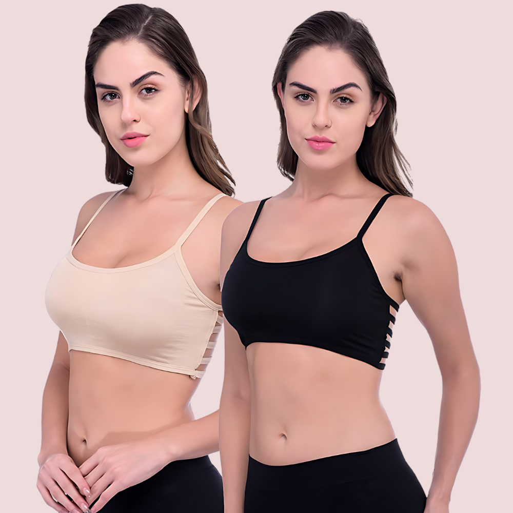 Two women wearing beige and black sports bras against a plain background