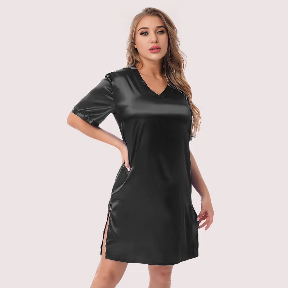 Woman wearing a black dress with vinyl accents on a white background