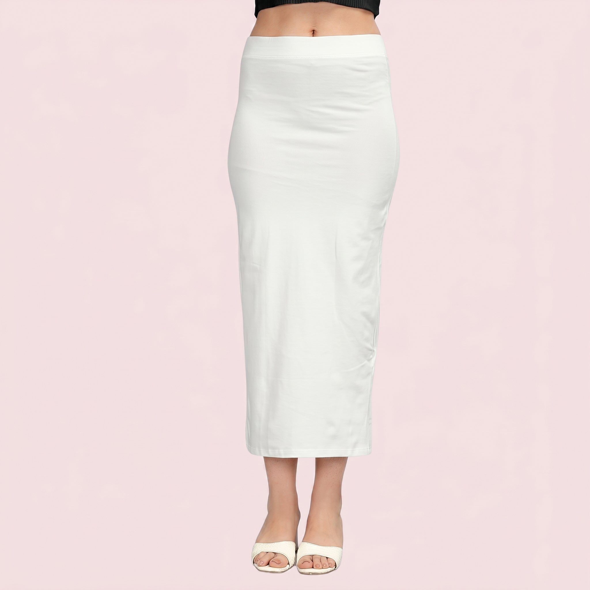 White pencil skirt worn by a person on a pink background