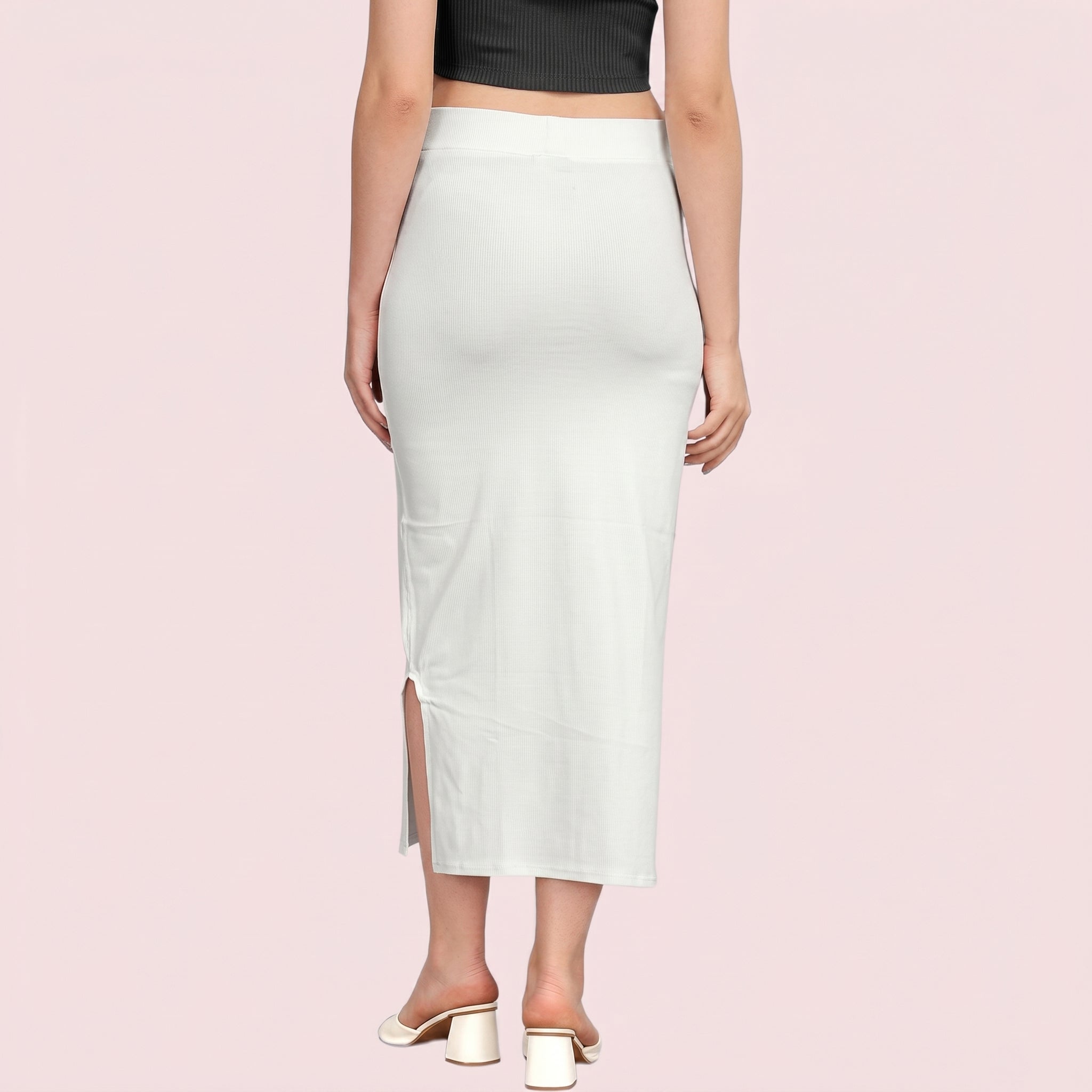Light green pencil skirt worn by a person on a pink background