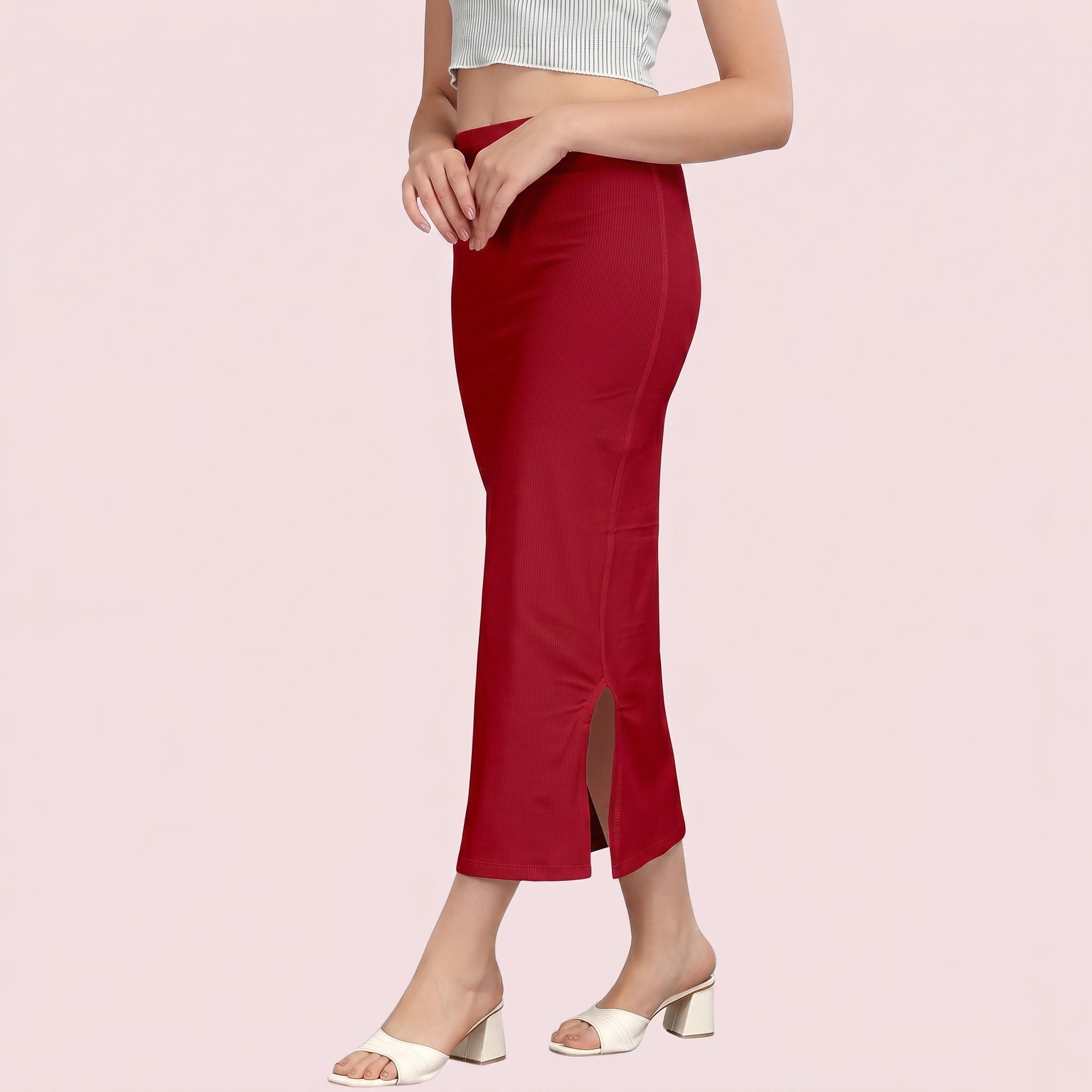 Red pants with a slit on a light pink background