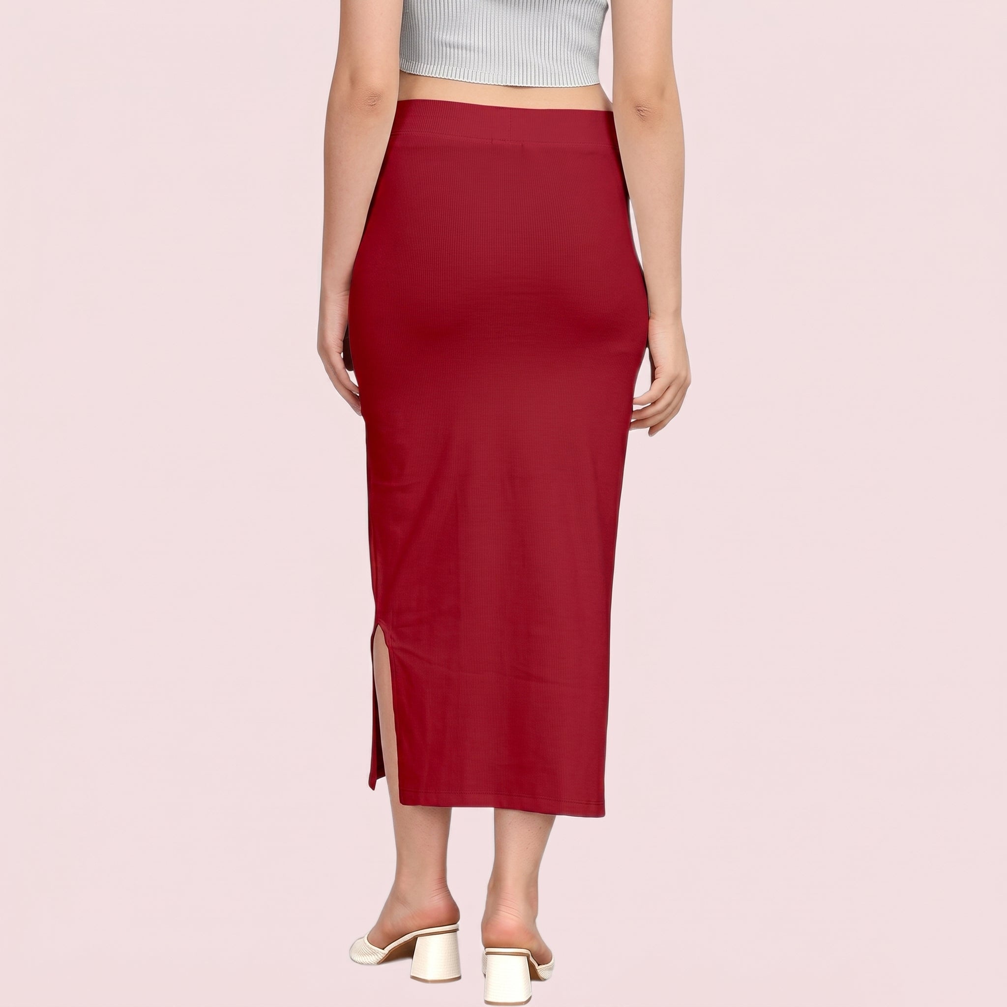 Red skirt with a slit on a pink background