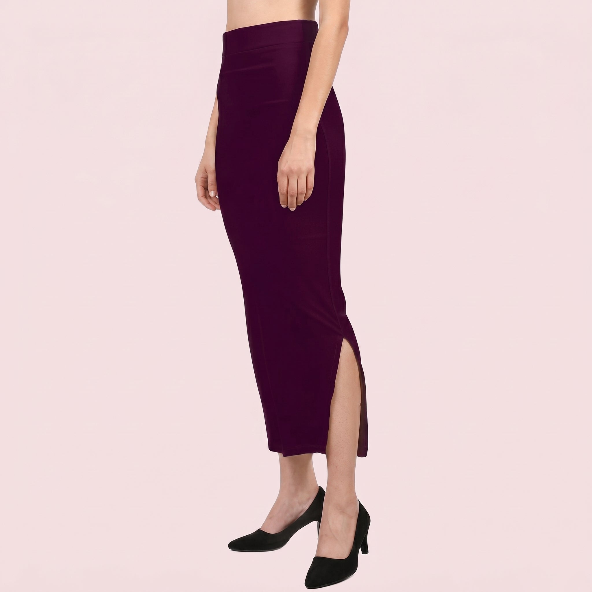 Purple pencil skirt worn by a person on a beige background