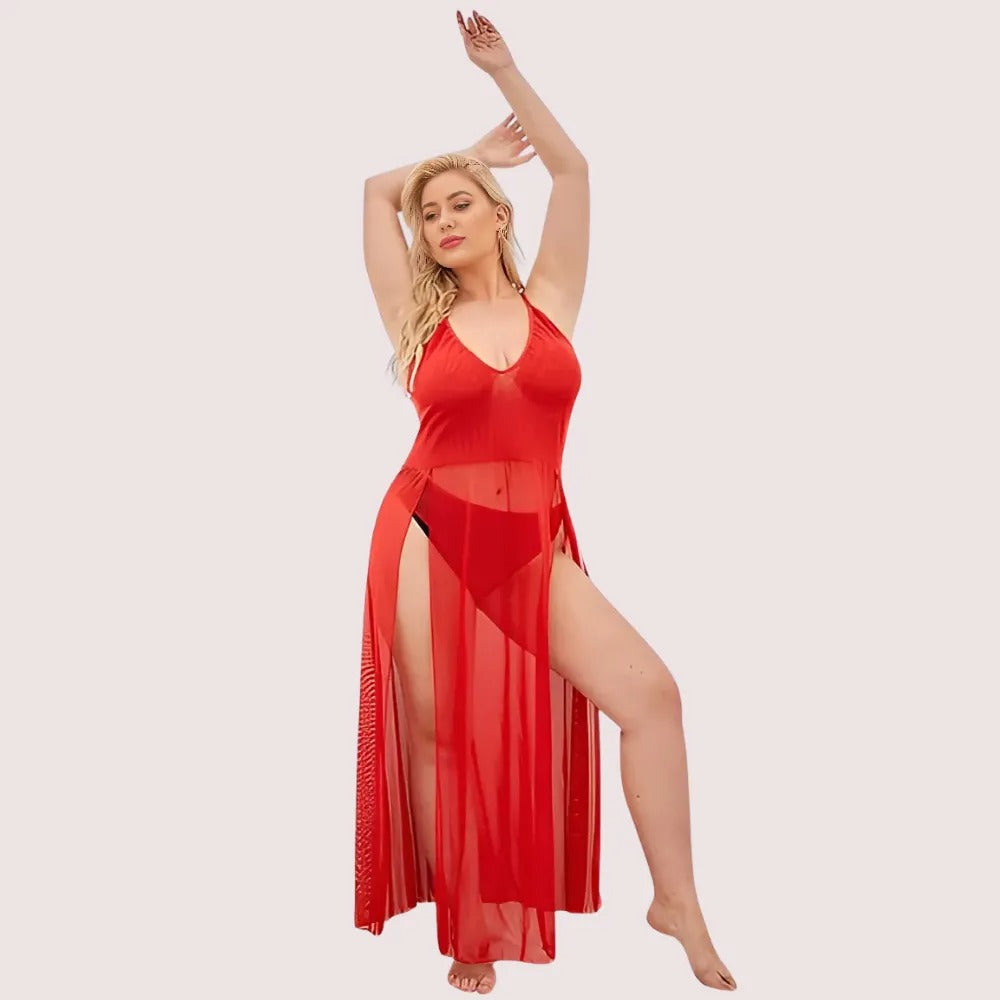 Woman wearing a red sheer dress on a light pink background