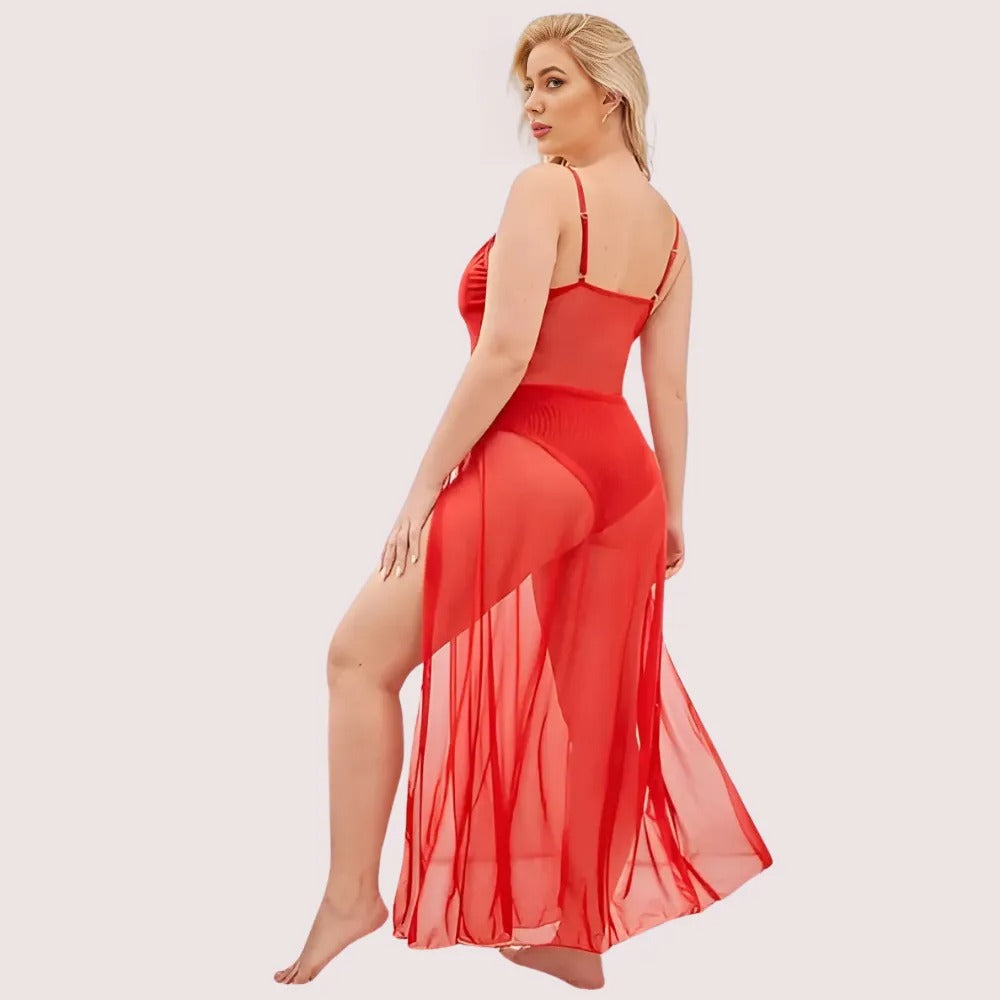 Woman wearing a red sheer outfit on a light pink background