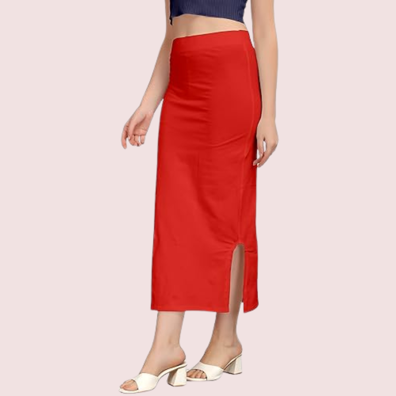 Red slip skirt worn by a person on a light pink background