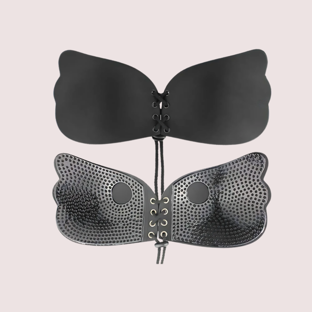 Black butterfly-shaped bra on a beige background