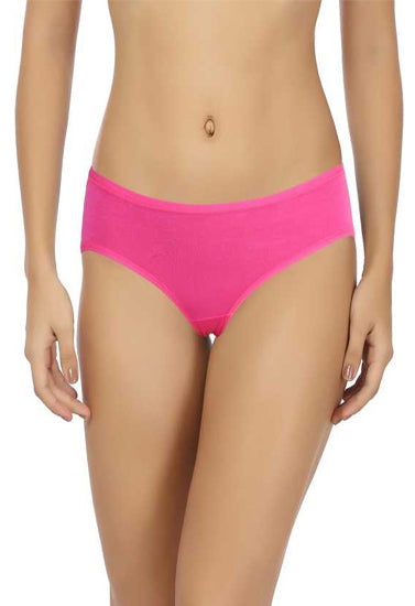 Person wearing bright pink bikini bottoms on a white background