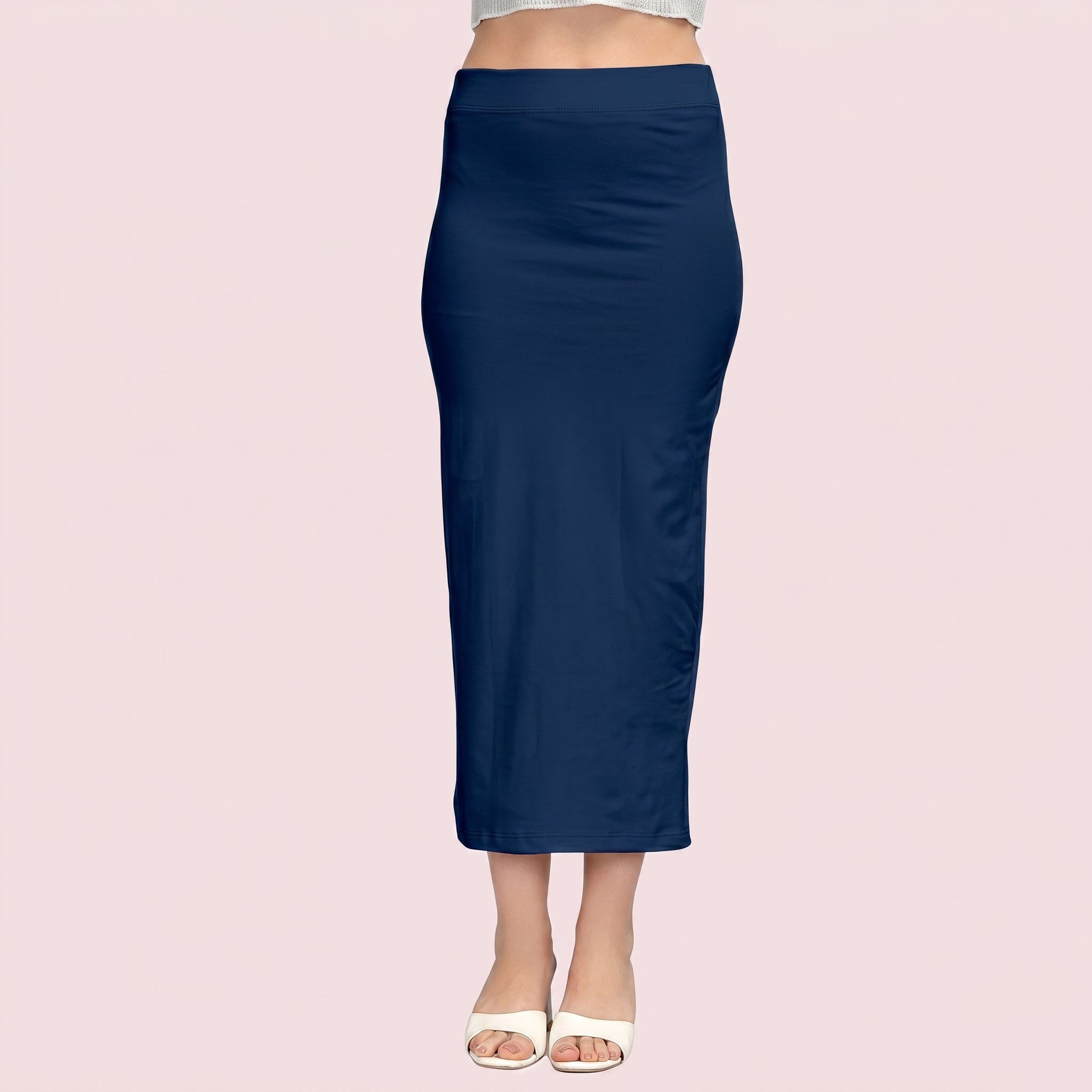 Navy blue skirt worn by a person on a light pink background