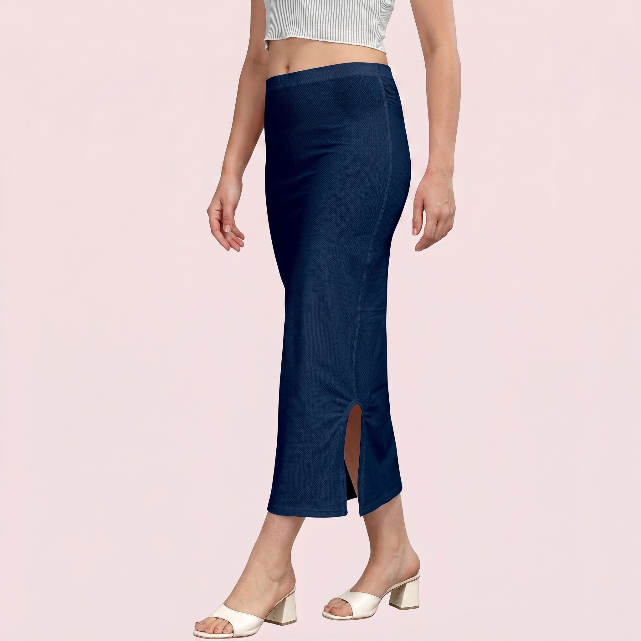 Navy blue skirt worn by a person on a light pink background