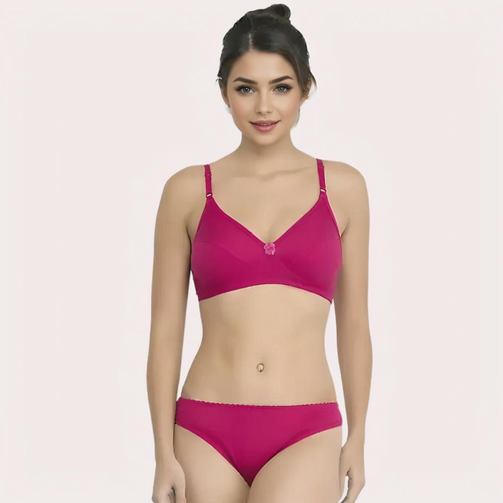 Woman wearing a magenta bra and panties set