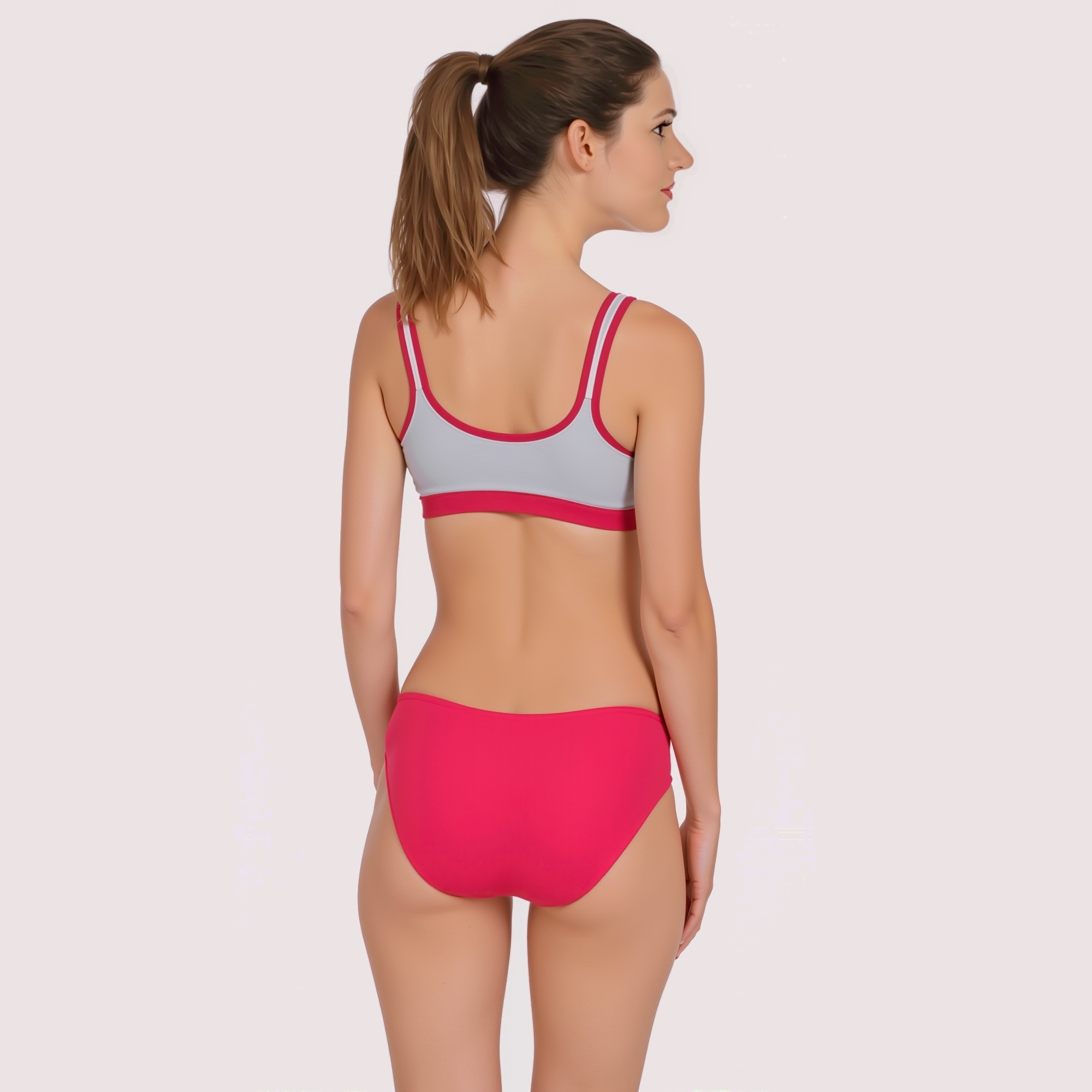 Woman wearing a two-tone bikini set on a plain background