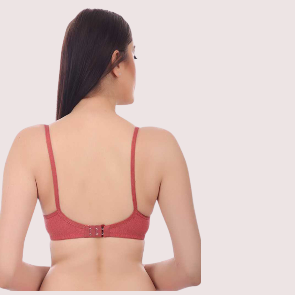 Red bra worn by a model on a light pink background