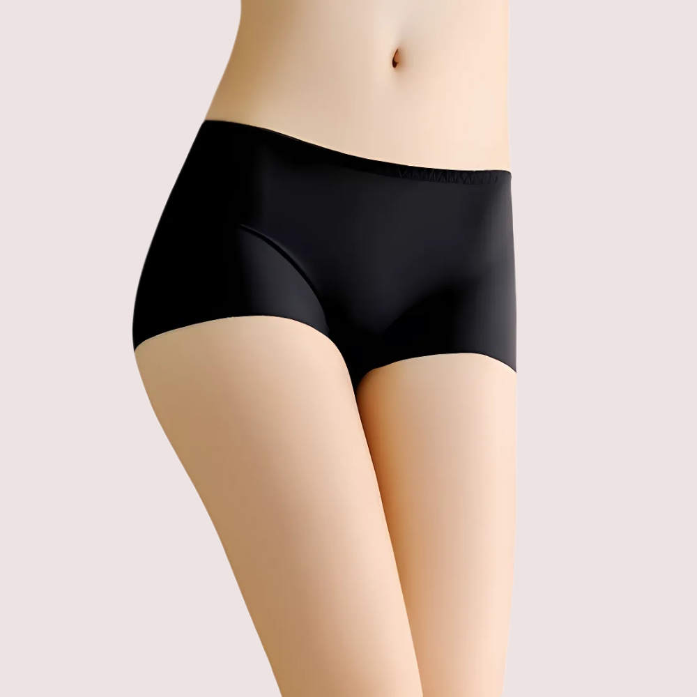 Black underwear worn by a person on a plain background