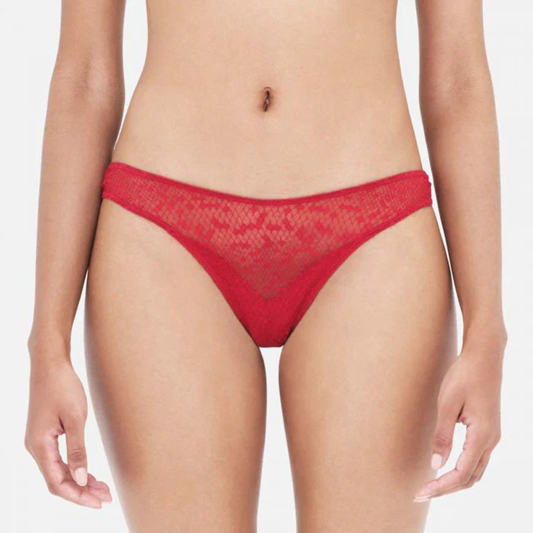 Red lace underwear on a plain background
