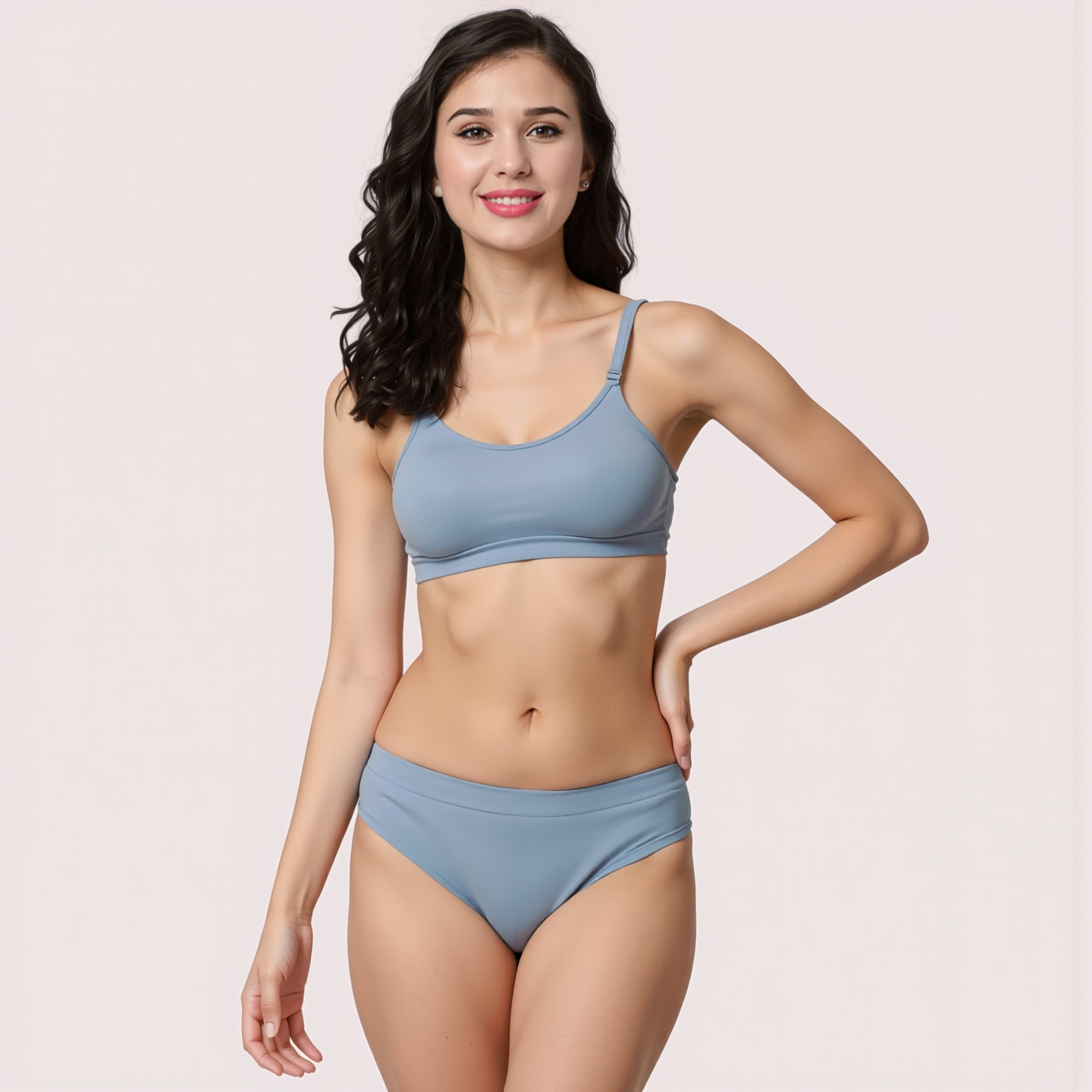 Woman wearing a light blue bikini set on a plain background