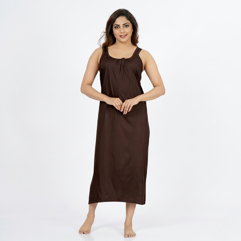 Woman wearing a brown sleeveless dress on a white background