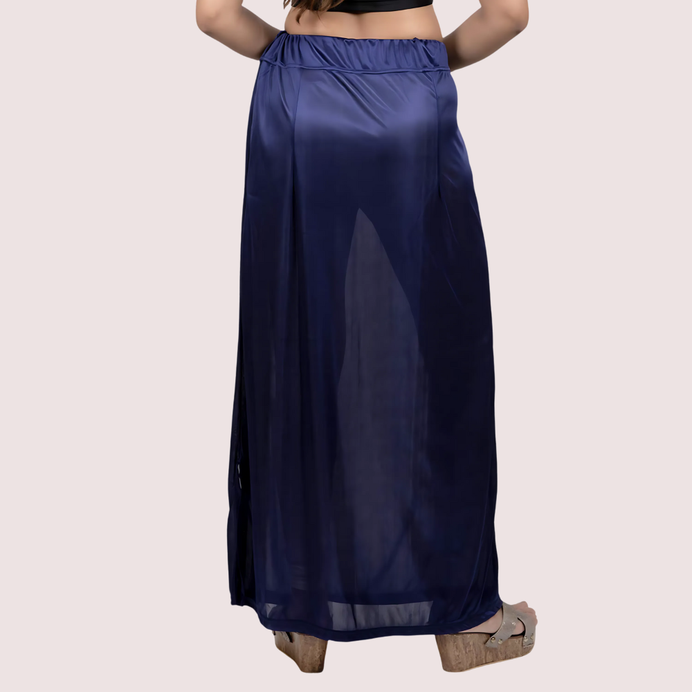 Navy blue skirt worn by a person on a light pink background